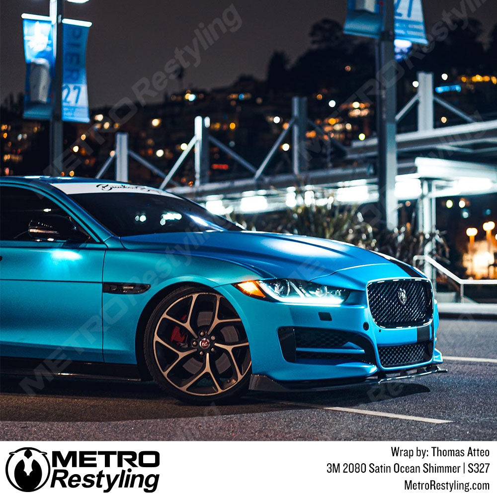 blue vinyl wrapped Jaguar