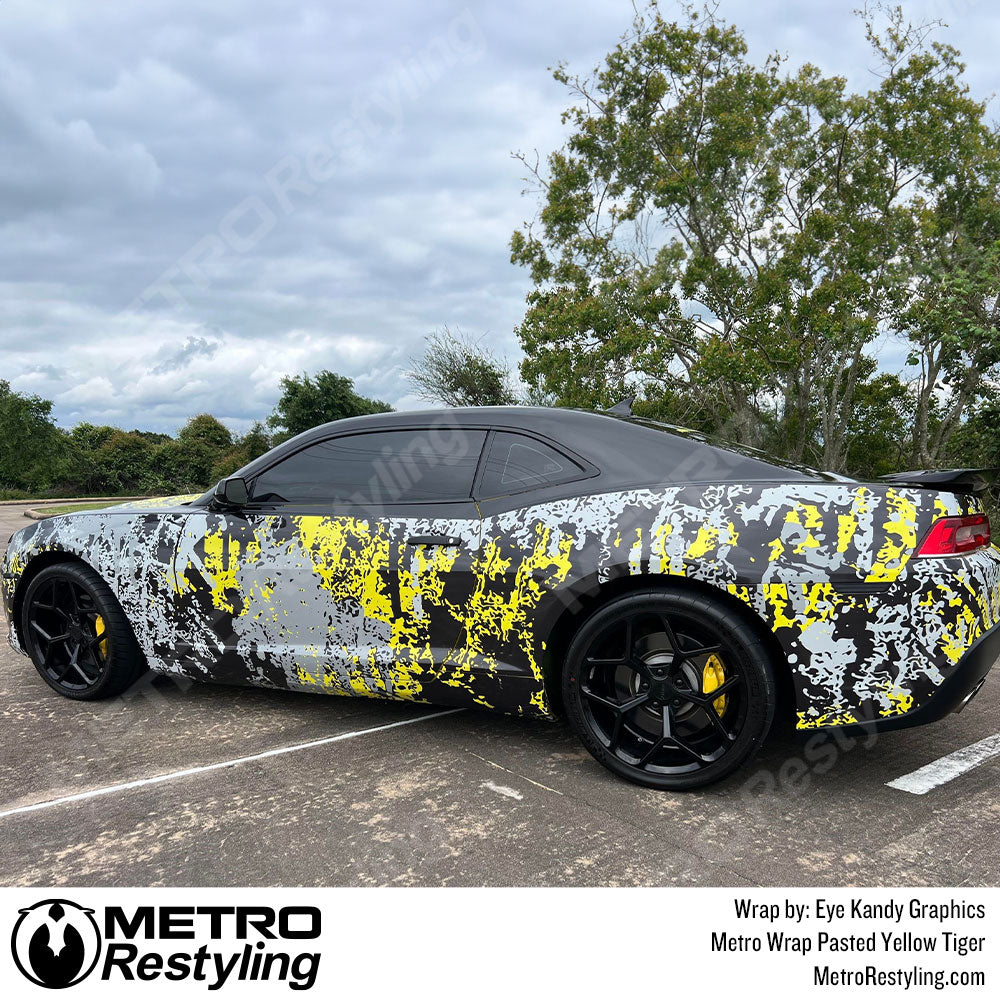 Yellow camo wrapped camaro