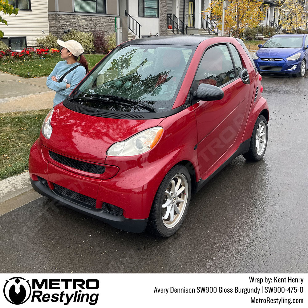 smart car wrapped with burgundy vinyl