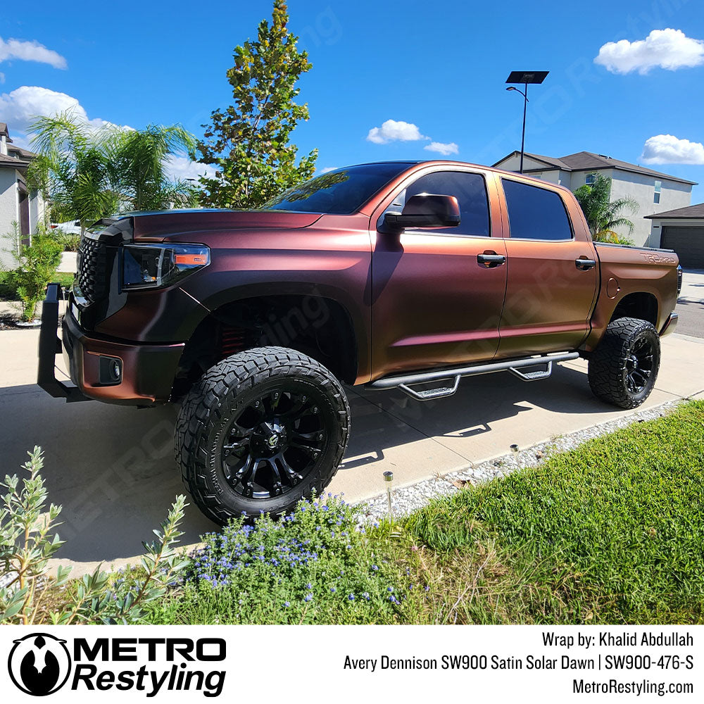 toyota truck with red color shift wrap