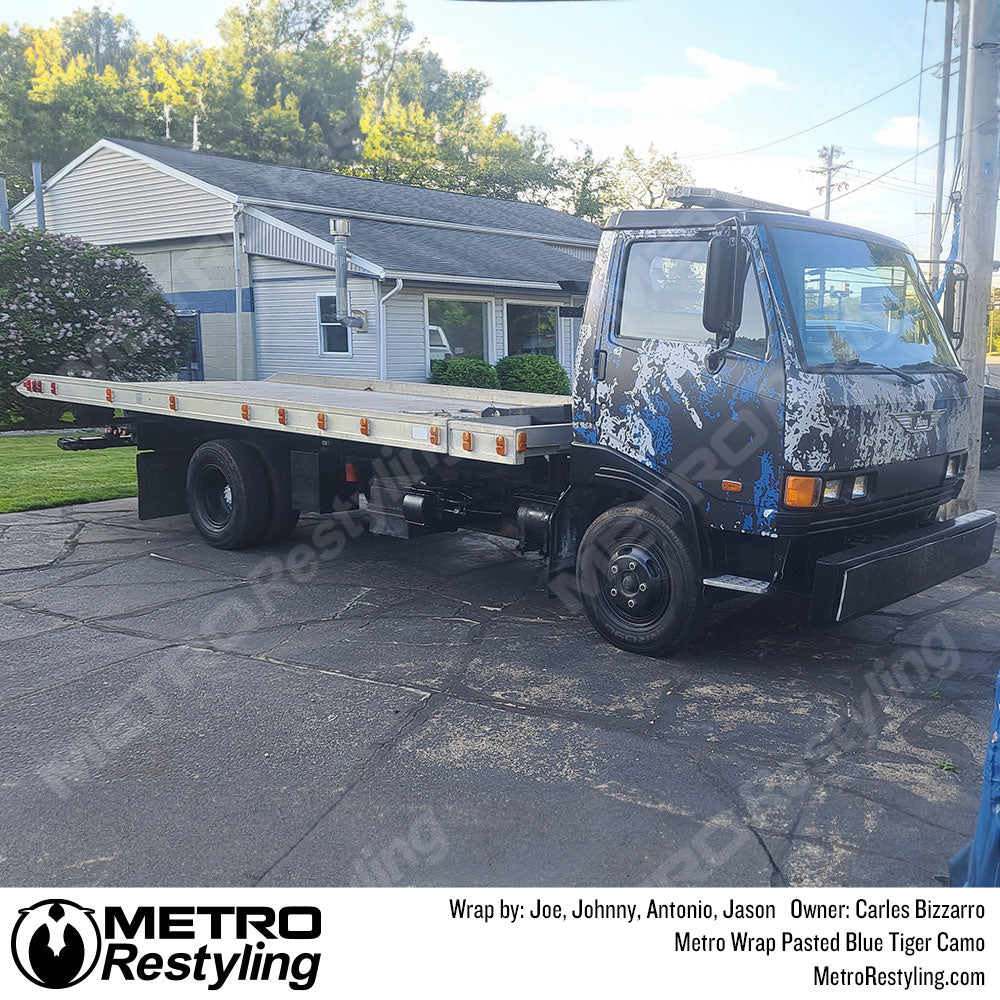 blue camo semi truck wrap
