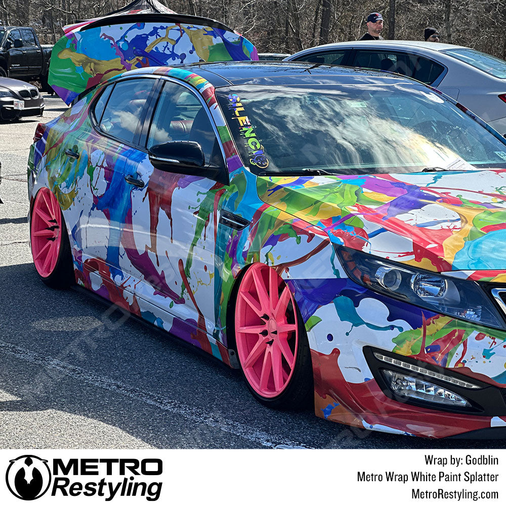kia wrapped in paint splatter