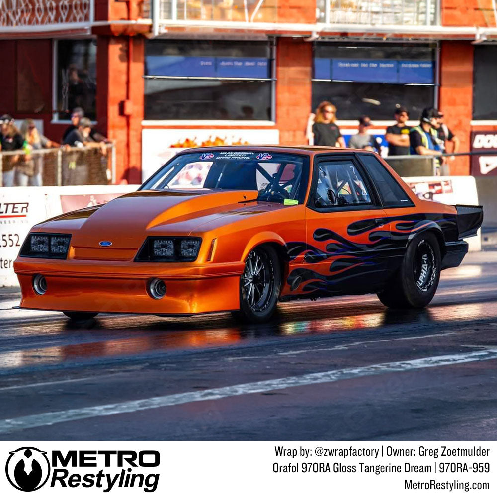 ford mustang with orange wrap