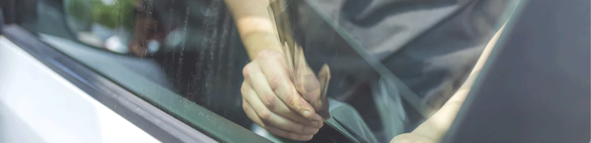 Man removing window tint