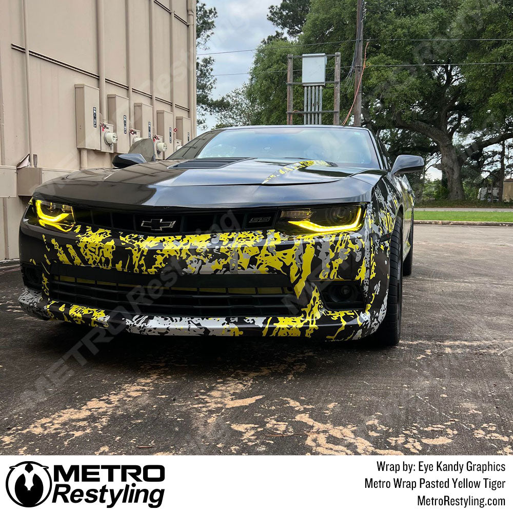 Yellow Pasted camo wrapped Chevy Camaro