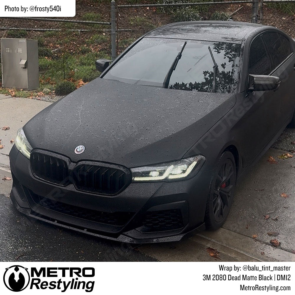 BMW with black vinyl wrap