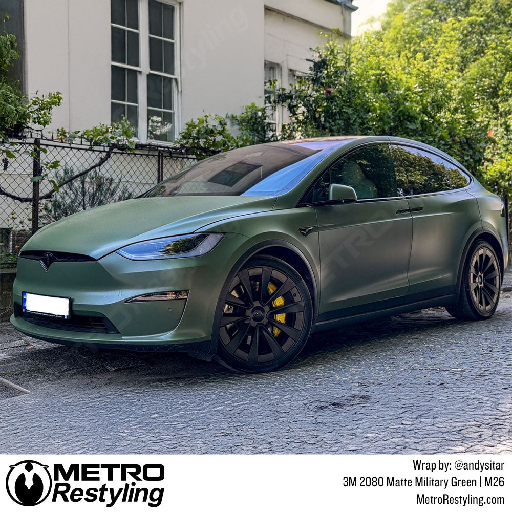tesla with green vinyl car wrap