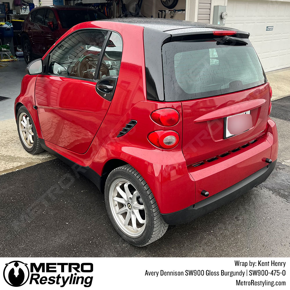 smart car wrapped with burgundy vinyl