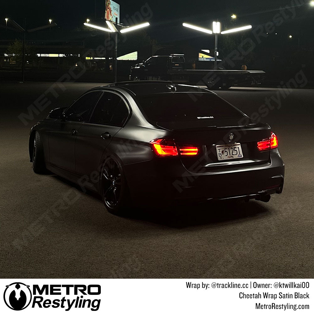 car with black vinyl wrap