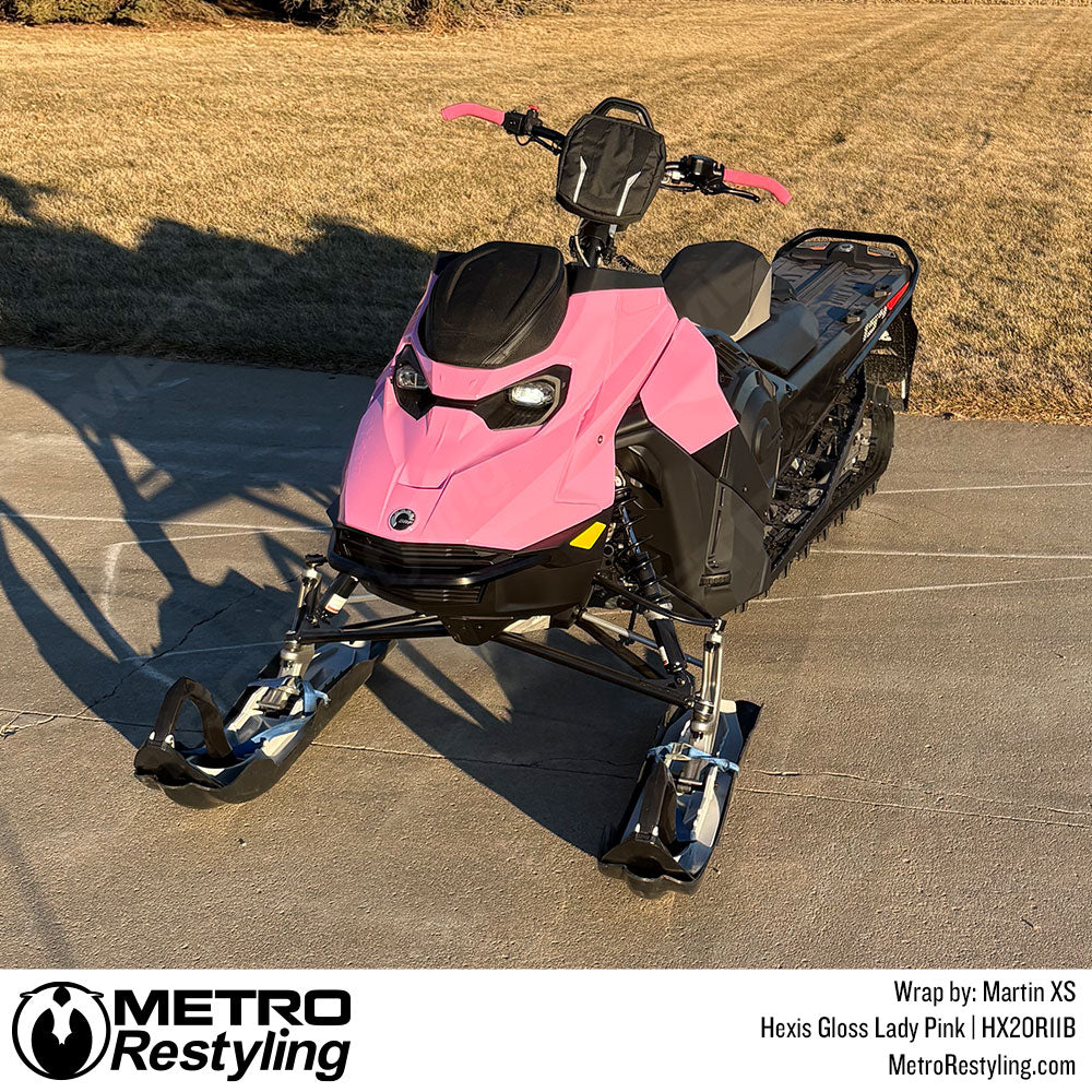 snowmobile with pink vinyl wrap